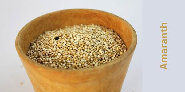 Off-white Amaranth seeds in a beautiful wooden bowl. 