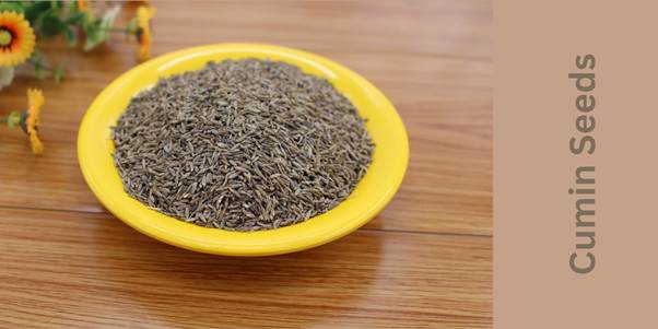 Cumin seeds are in a cute yellow plate.