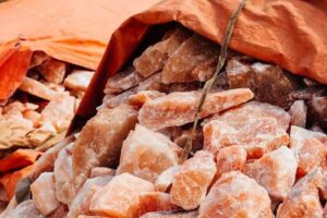 Natural occurring pink salt with shades of reddish-brown, pink and orange shades